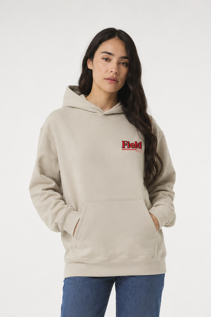 Ivory pullover hoodie with red Field logo on chest and front kangaroo pocket