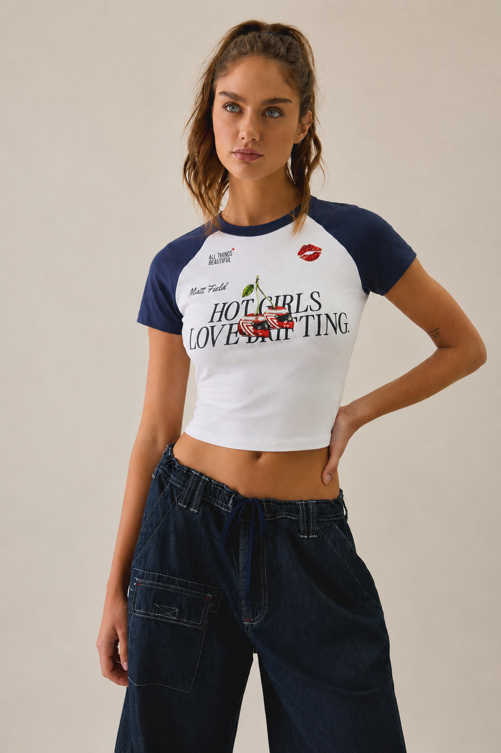 Two-tone navy/white baby tee with 'HOT GIRLS LOVE DRIFTING' center graphic