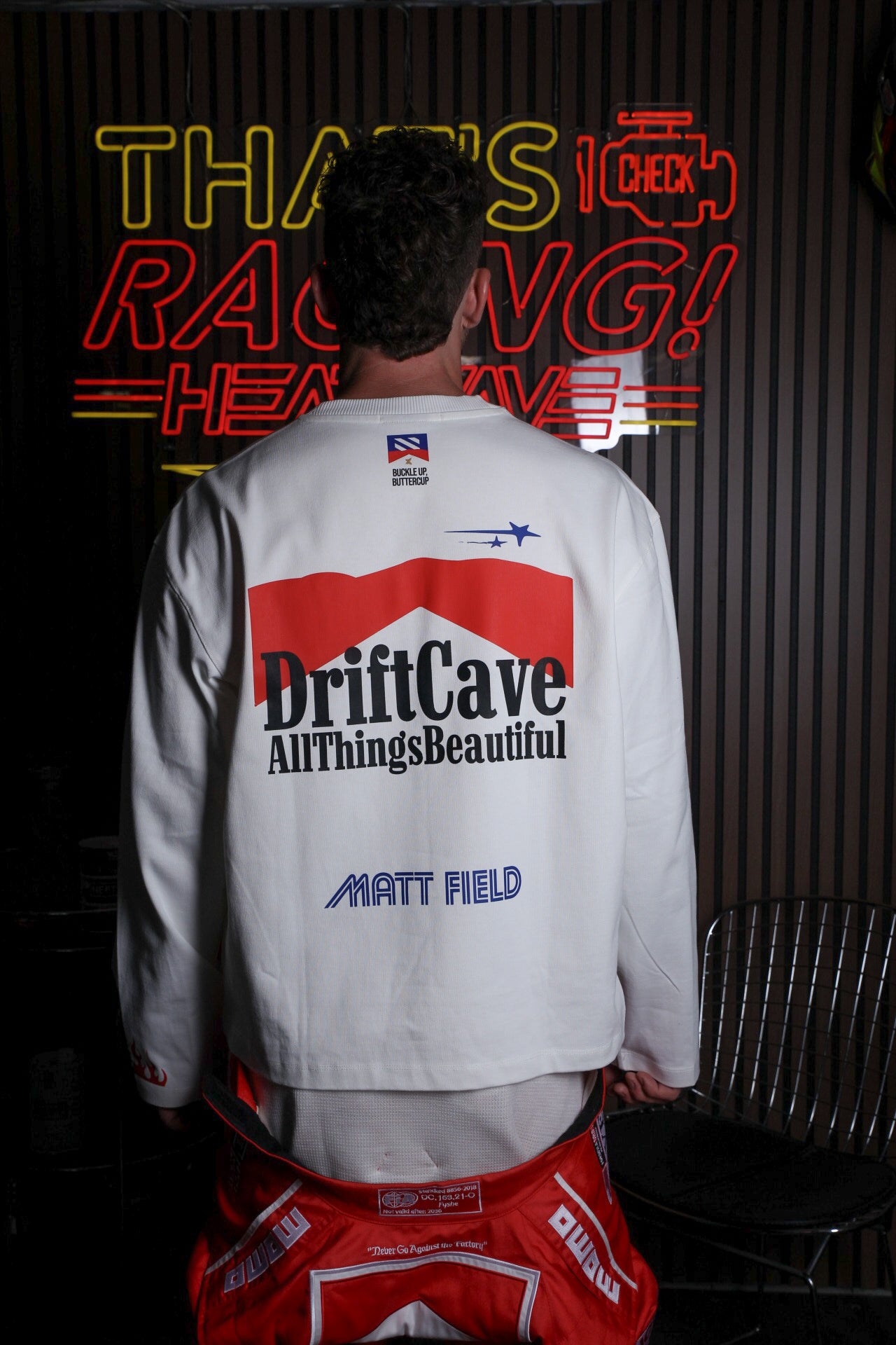 White long-sleeve shirt with DriftCave back graphic and Matt Field logo on lower back
