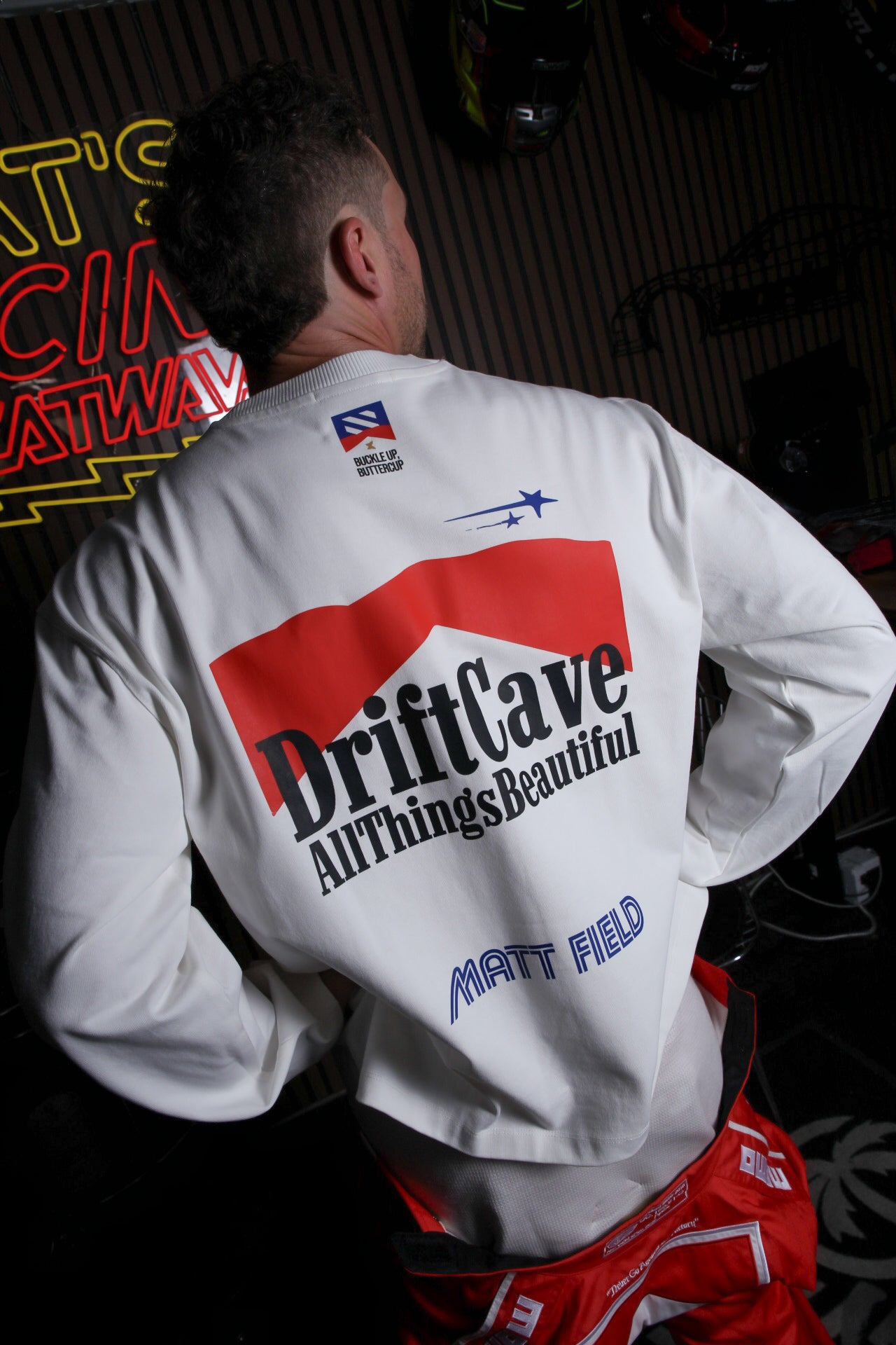 White long-sleeve shirt with large DriftCave back print and Matt Field text