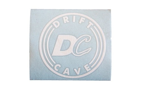 Round sticker with DC CAVE logo, light blue and white print