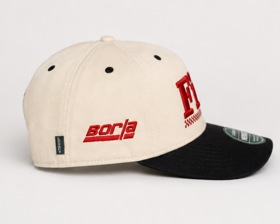 Cream and black baseball cap with 'bora' logo and red side tag, adjustable strap