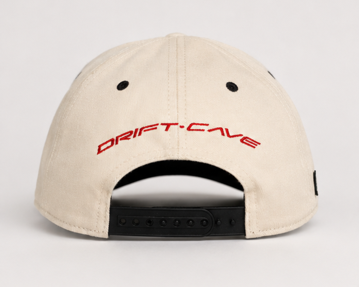 Cream baseball cap with 'DRIFT-CAFE' logo and open back strap holes