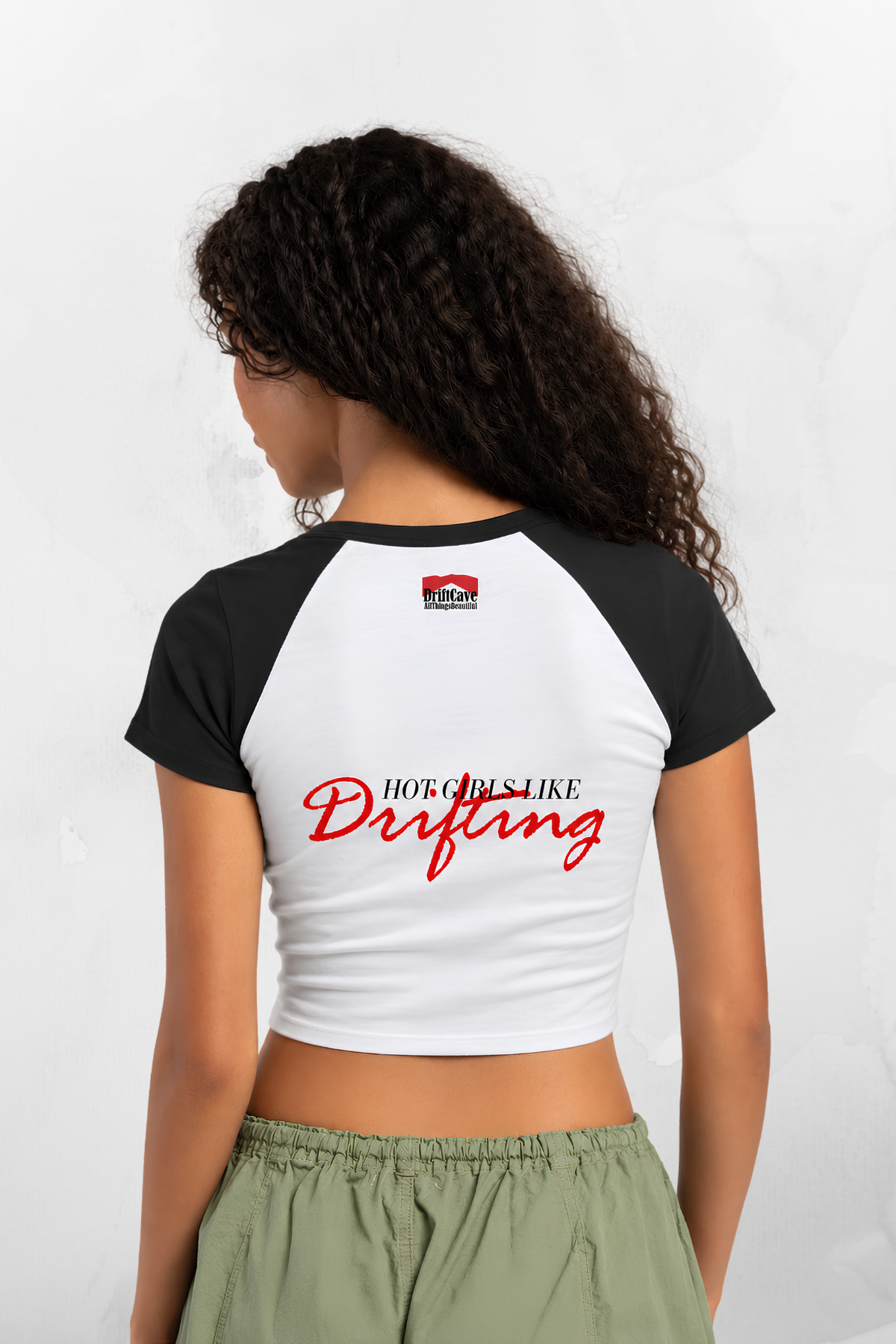Black-sleeve white raglan baby tee with red “Hot Girls Like Drifting” on the back