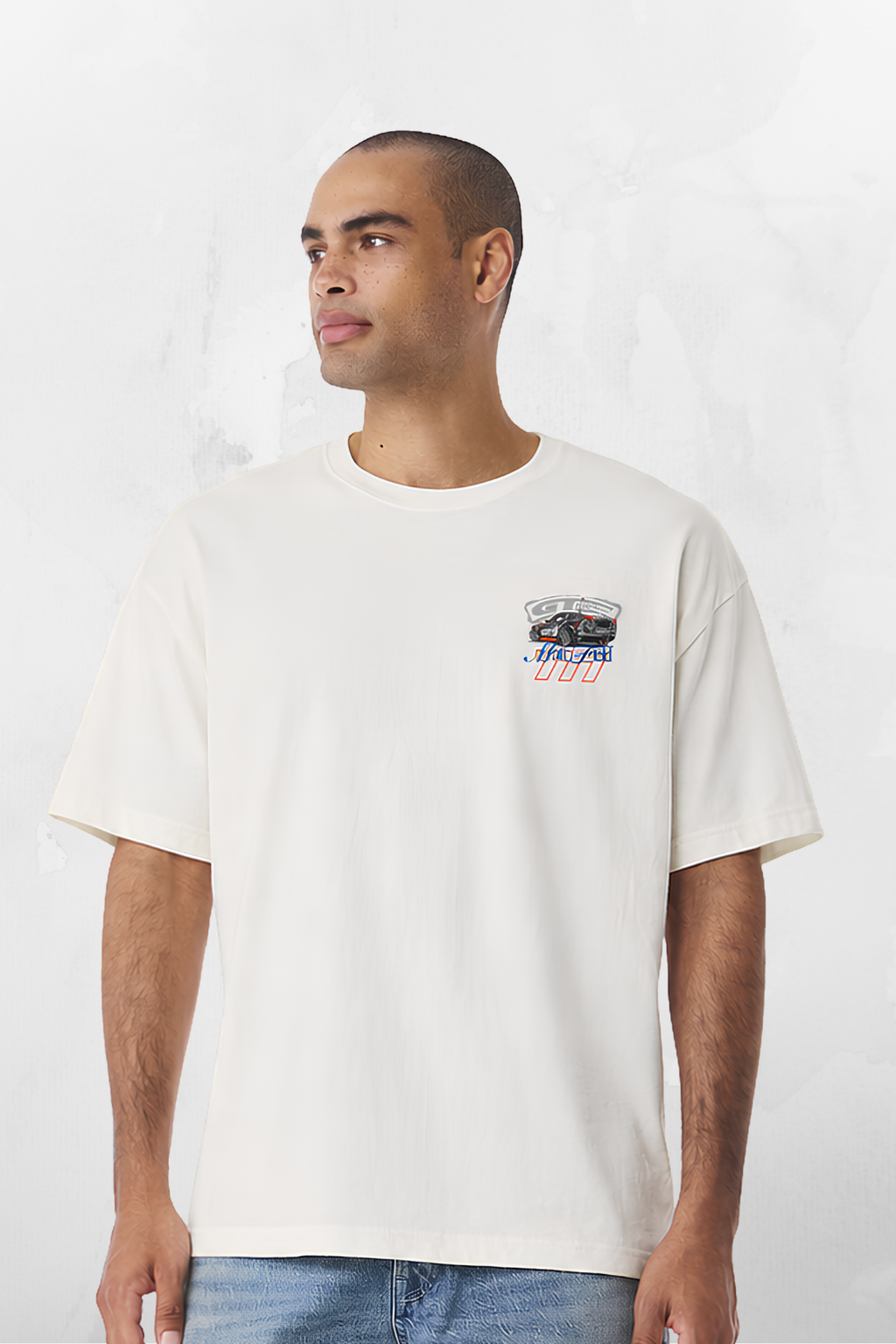 White T-shirt with small chest graphic featuring a race car and text