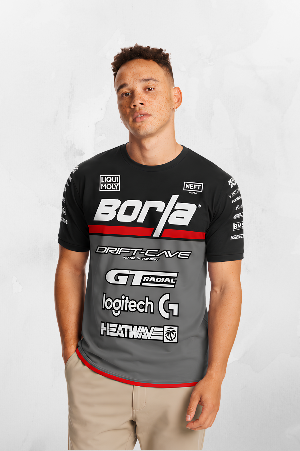 Black team jersey with front sponsor logos, red neckline and hem trim